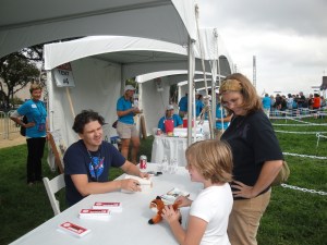 The Girl charming Dave Eggers at the National Book Festival.